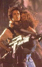 [Ripley with gun, and Newt]
